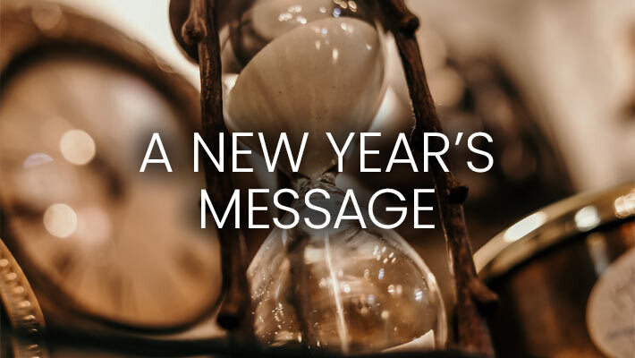 Hour glass and clocks with the text A New Year's Message