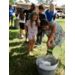 Kids forming a bucket brigade.