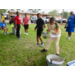 Kids making a bucket brigade.