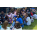 Kids sitting outside having lunch.