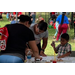 People at a table doing crafts.