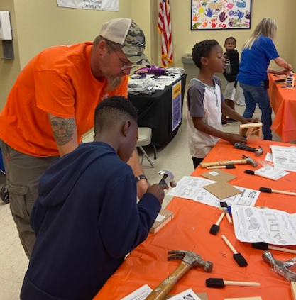 People working on the Home Depot craft.