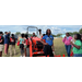 Young people around a tractor.